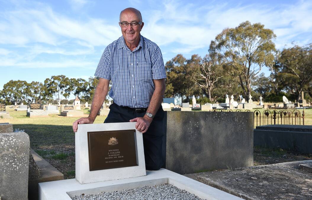 PROUD: John Collins at his great uncle's grave, which was one of five officially dedicated in a ceremony at Carlyle cemetery on Remembrance Day. 