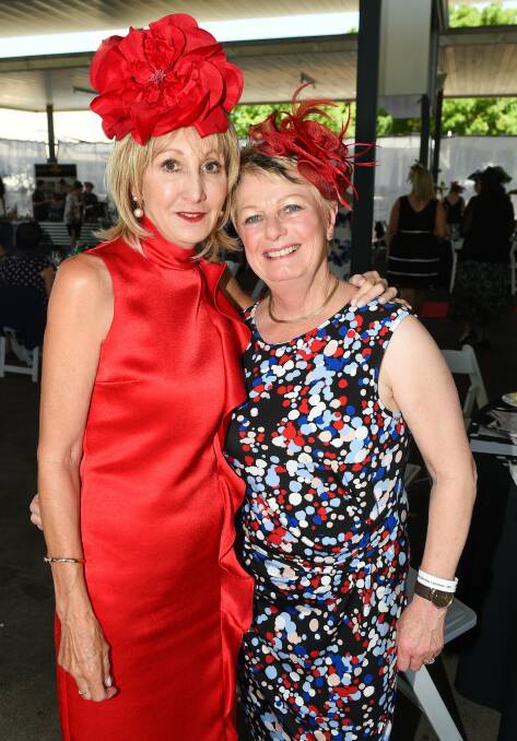 SHARING THE MOMENT: Maureen Mathews and Gail Mathews are snapped together as guests mingle during Thursday's Oaks Day luncheon. Pictures: MARK JESSER