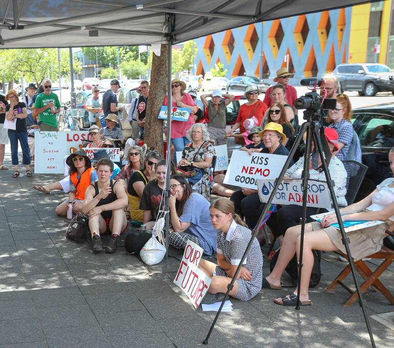 CALL FOR CHANGE: Students and their supporters outside the office of member for Farrer Sussan Ley yesterday, calling for climate change action. Picture: JAMES WILTSHIRE