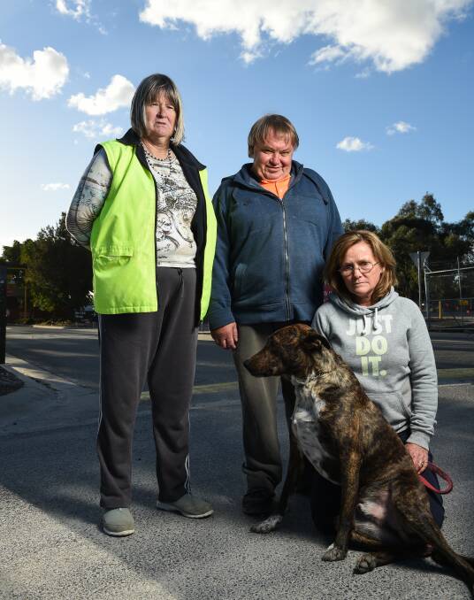 END OF A ERA: Wodonga Dog Rescue volunteers Shirley Giles, Wayne Higgins and Peta McRae, with dog Jordi, are sad the pound will close in July. Picture: MARK JESSER