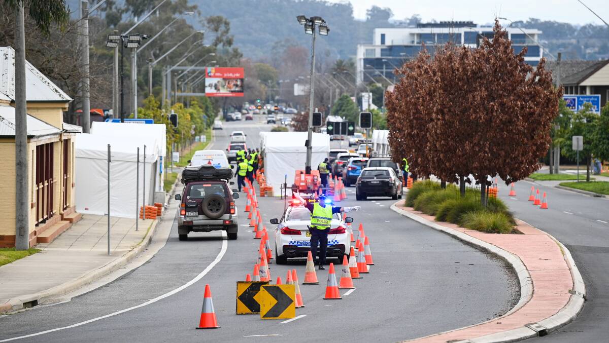 LEFT: An enormous amount of police and Defence personnel were required to man checkpoints. 