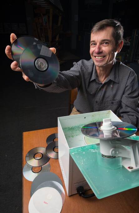 SAFE FROM SCRATCHES: Lubosh Hanuska, of Repair Cafe Albury-Wodonga, will be in charge of repairing people's favourite CDs and DVDs during the group's next session at the Sustainable Activity Centre. Picture: MARK JESSER 