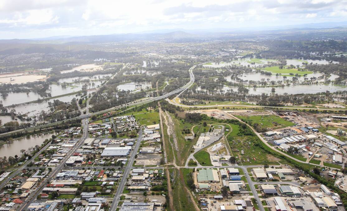 DELUGE: A view looking north towards the Hume Freeway from Wodonga, which reveals the full extent of floodwaters spreading on the Border following rain.