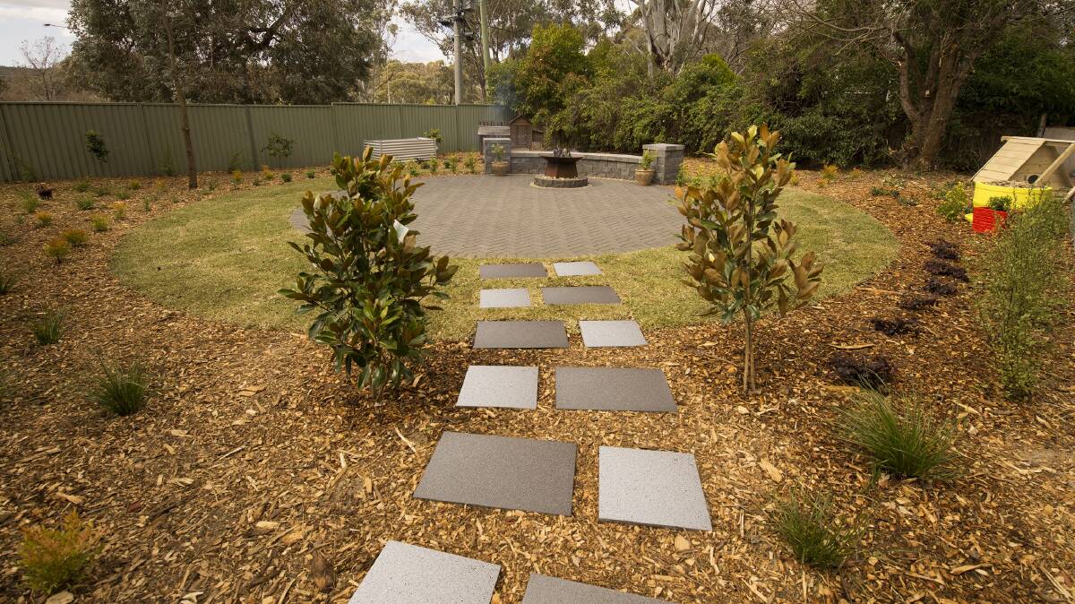 If the façade of your home needs work, consider taking the focus away from the home by having a path off the house leading to a feature courtyard.