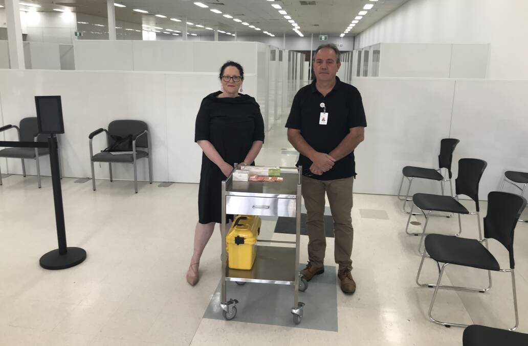 Albury Wodonga Health chief operating officer Emma Poland and director of infrastructure Phillip Todhunter in the former Coles building in Wodonga that is being turned into a vaccination hub. 