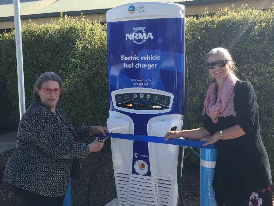READY TO GO: Greater Hume mayor Heather Wilton and NRMA motoring executive general manager Nell Payne officially launched the Holbrook charger. Picture: SUPPLIED