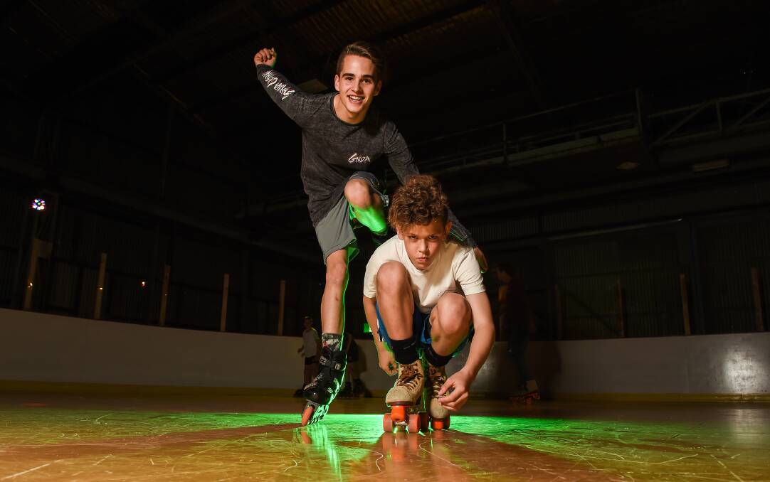ROLL UP: Ryan McEvoy, 16, and brother Owen, 12, from Albury hit the rink at the Albury Skating Centre for an event celebrating headspace. Picture: MARK JESSER