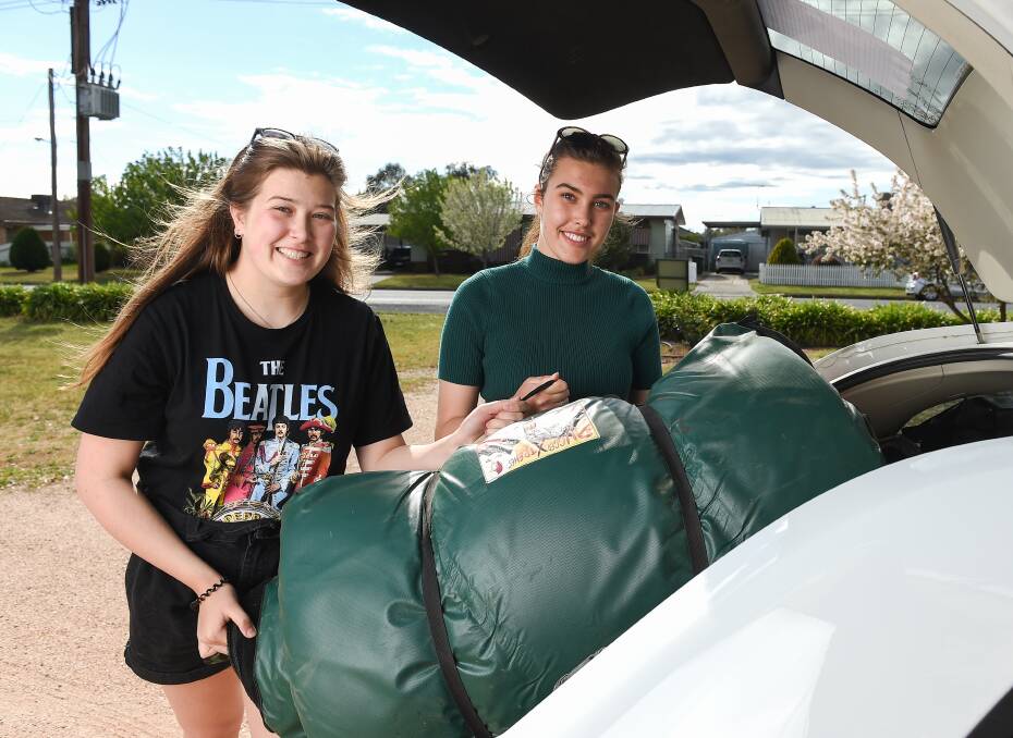 READY TO GO: Rohana Brinkmann, 15, and sister Elyse, 17, are travelling with their parents and neighbours from Walla to South Australia. Pictures: MARK JESSER