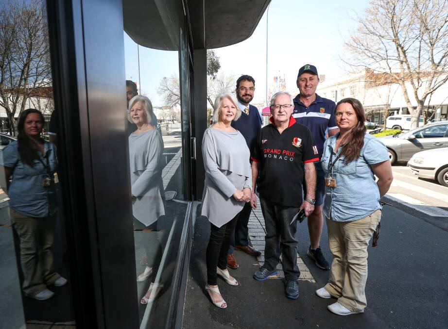 RESULT: Vince Glenane (front) has distributed funds from the easter egg hunt to Helen Vey (Hilltop Albury Wodonga Patient and Carer Accommodation Centre), Tim Farrah and Tim Sanson (Boys to the Bush), and Davina Jackson (Betty's Place). Picture: JAMES WILTSHIRE