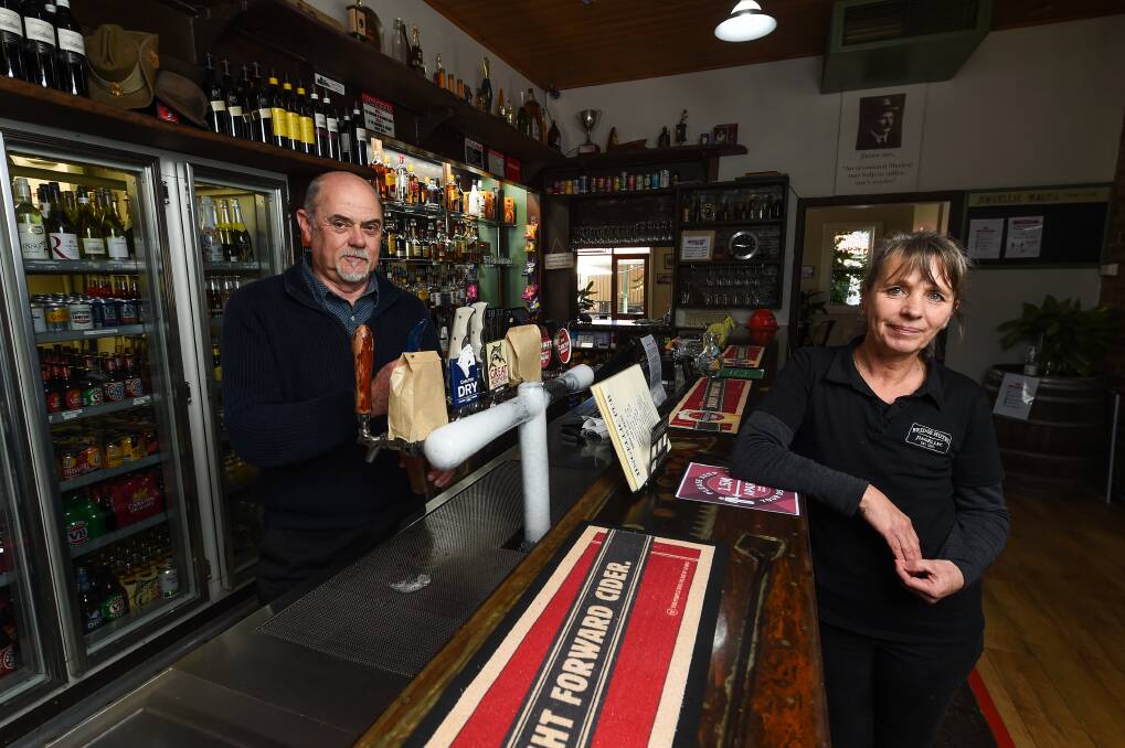 FREE TO PASS: Jingellic pub's Peter Wilson and Elena Bettio have received permits to get to work. Picture: MARK JESSER