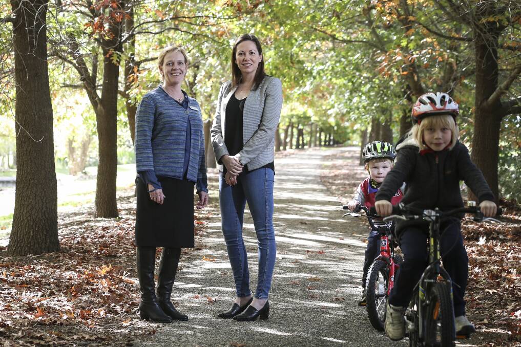 ON THE WAY: Jenny O'Connor and Jaclyn Symes with Felix McLachlan, 5, and Charlie, 7, at the announcement of $12 million for cycle tourism. Picture: JAMES WILTSHIRE