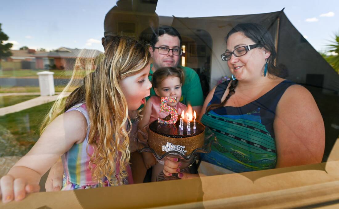 FREE: Sophia Kilday spent her 5th birthday in isolation on Tuesday, with dad Clint, sister Zoe, 2, and mum Corissa, as the family pleaded with DHHS to follow more recent rules. AWH has now released them. Picture: MARK JESSER