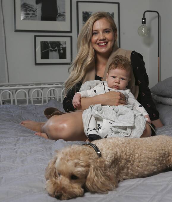 NO NEWS: Lia Larsen, with son, Jessie, says there has been no budget announcements for young families to celebrate with her husband, Josh. Picture: ELENOR TEDENBORG