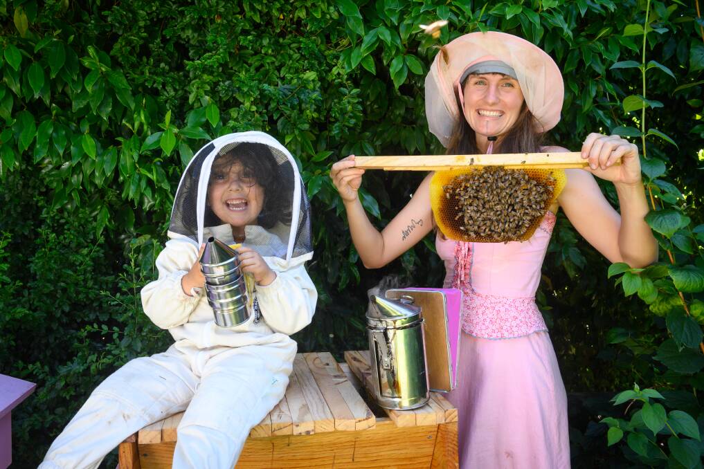 JOY: Eskdale's Emily Mikschi operates the Kenyan Top Bar Hive with her daughter, Olive Caparra, 3. 