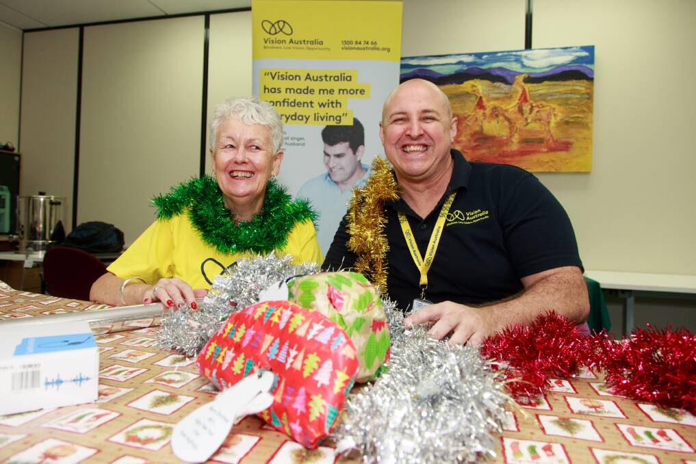 IN THE SPIRIT: Chris Harris and Troy Gladwell are encouraging community members to volunteer to gift-wrap. Picture: SIMON BAYLISS