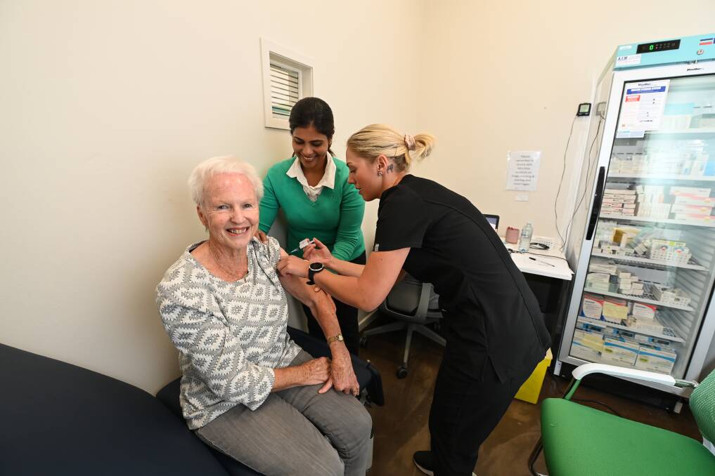 EAGER: Yackandandah's Trish Stanton, 76, receives her first AstraZeneca vaccine at the Sarkon Medical clinic from Dr Priya Kondappan and RN Lisa Brown. Picture: MARK JESSER