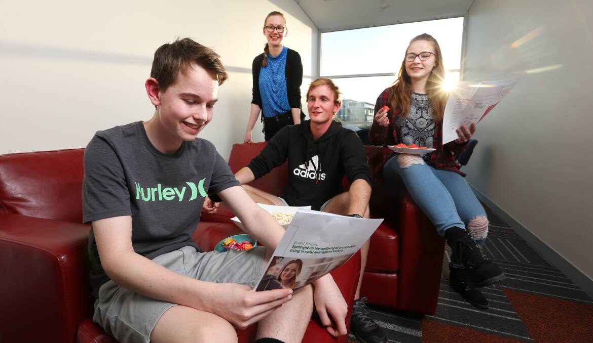 LOOKING FORWARD: headpsace Albury-Wodonga youth reference group members Ethan Coffey-Hill, 15, Nicola Ball, 23, Josh Rickard, 21, Makayla Pollard-Chivers, 16, discuss a VicHealth report. Picture: KYLIE ESLER