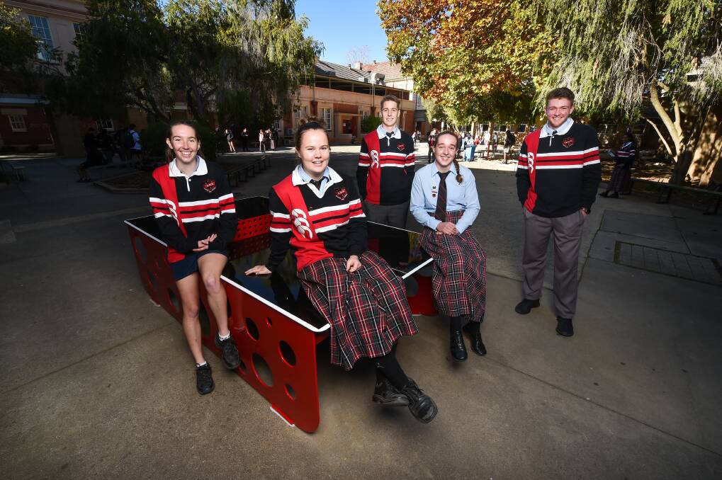 BACK TOGETHER: Albury High year 12 students Laura Gillard, 17, Rylee Shepherd, 17, Simon Thomson, 17, Natalie Gibbons, 18 and Will Bowden, 17, are happy to be back at school for the first time in weeks. Picture: MARK JESSER