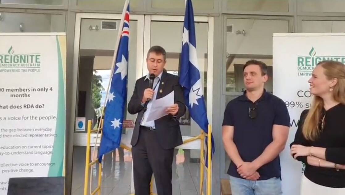 MP Tim Quilty speaking at a Reignite Democracy Australia event held by organisers Morgan C. Jonas and Monica Smit. 