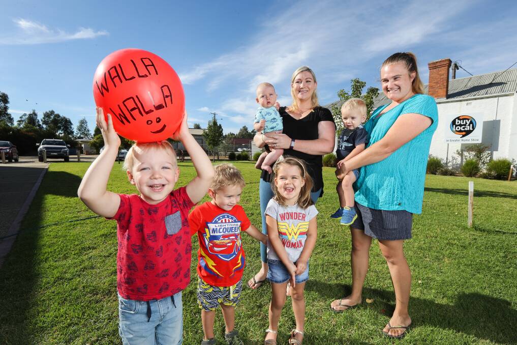 ECSTATIC: Mums Cass Jacobs and Rebecca Mott with Seth Jacob, 4, Hamish Mott, 3, Eliza Feuerherdt, 3, Ashton Jacob, 7 months and Mason Mott, 1, next to the site where a children's hub will be built in Walla. Picture: MARK JESSER
