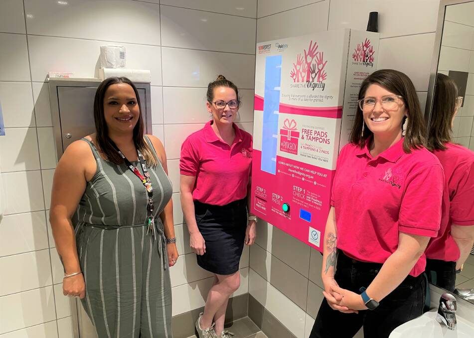 NOW LIVE: Albury Council youth programs co-ordinator Bianca Edwards and Share the Dignity volunteers Rebecca O'Brien and Ashley Edwards inspect the new machine.