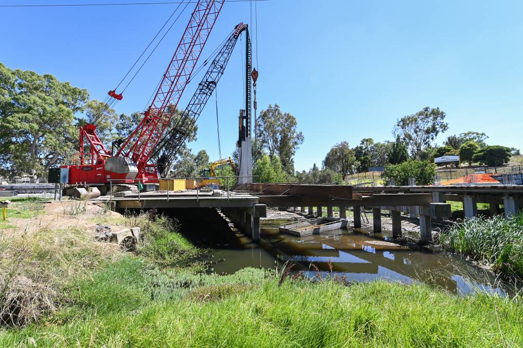 DELAYED: The replacement of Lawrence Street Bridge will take at least two months longer than initially planned. It was being dismantled last month, and new bridge beams have been installed this week. Picture: MARK JESSER