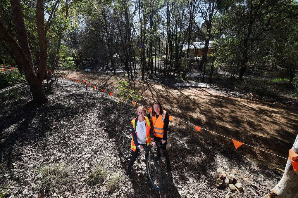 FINISH LINE: Indigo Council has approved a $750,000 overspend on the Beechworth to Yackandandah Rail Trail, which will be done in November after works started in 2018 - observed by mayor Jenny O'Connor and MP Jacyln Symes.