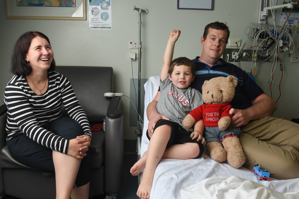 OK: Jennifer Hyland, her fiance Neil and their son Charlie were pulled over on Goorambat Road 16 minutes from a NSW ambulance station, but say there was confusion over which state would respond. Charlie will undergo more testing at the Royal Children's Hospital. Pictures: MARK JESSER