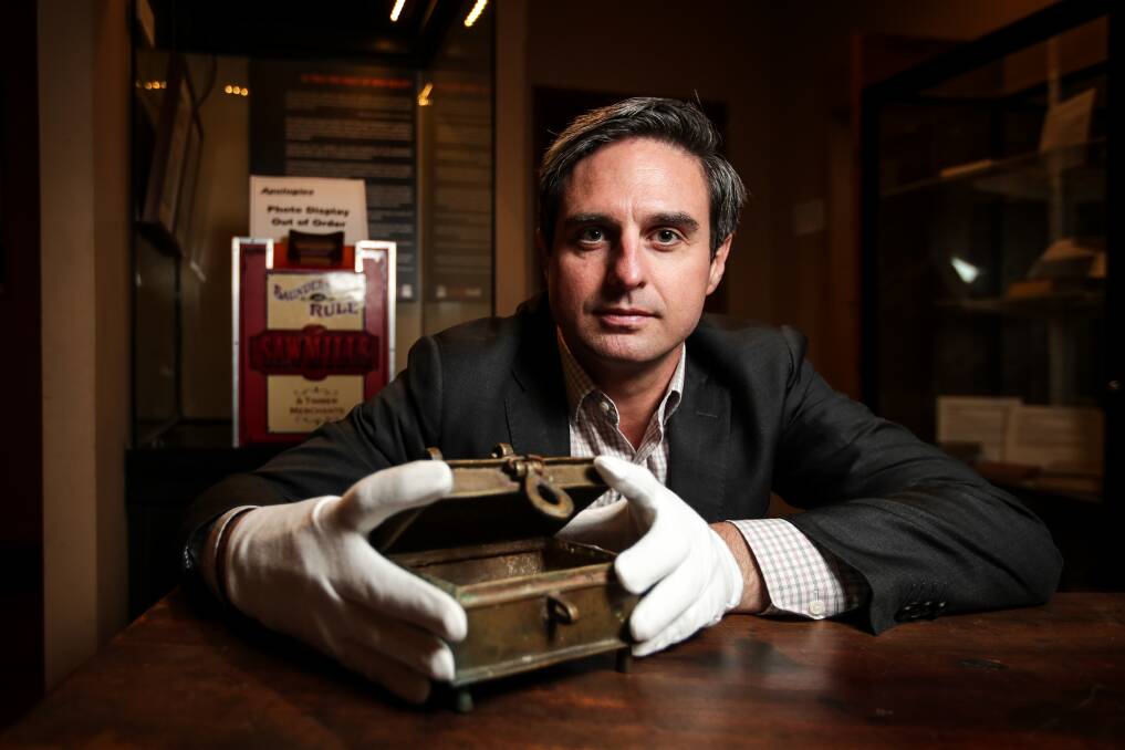 HISTORIC: Burke Museum manager Cameron Auty with the original brass cash box that was at the Glenrowan Inn during the Kelly Gang's last stand. Picture: JAMES WILTSHIRE
