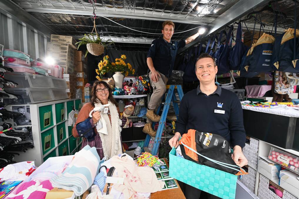 GROUP EFFORT: Storage King store manager Phil Jamieson has supported Joanne Knight in running Tots2Teens and worked with KDEC's Joel Merkel to bring light to their shed through charity of both businesses. Picture: MARK JESSER