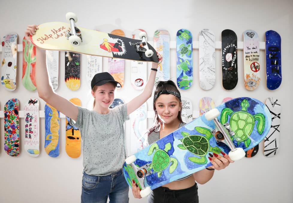 WINNERS: Emma Frampton, 14, and Brooke Chiang, 15, won the Deck'd competition and now have their art on skateboards. Picture: KYLIE ESLER