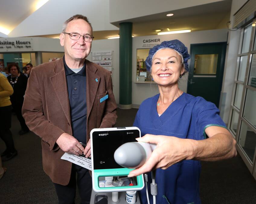 DONATION: Albury Wodonga Prostate Cancer Support Group co-convener Glenn Rose and registered nurse Jacquie Jackson with the new scanner. Picture: JAMES WILTSHIRE