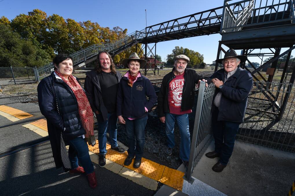 RETAIN IT: Karen Schoff, Paul Wilksch, Secretary Kirsty Wilksch, Les Fraser and Alan Wilson want to see the historic rail footbridge at Culcairn retained for the community after it is removed for the Inland Rail. Picture: MARK JESSER