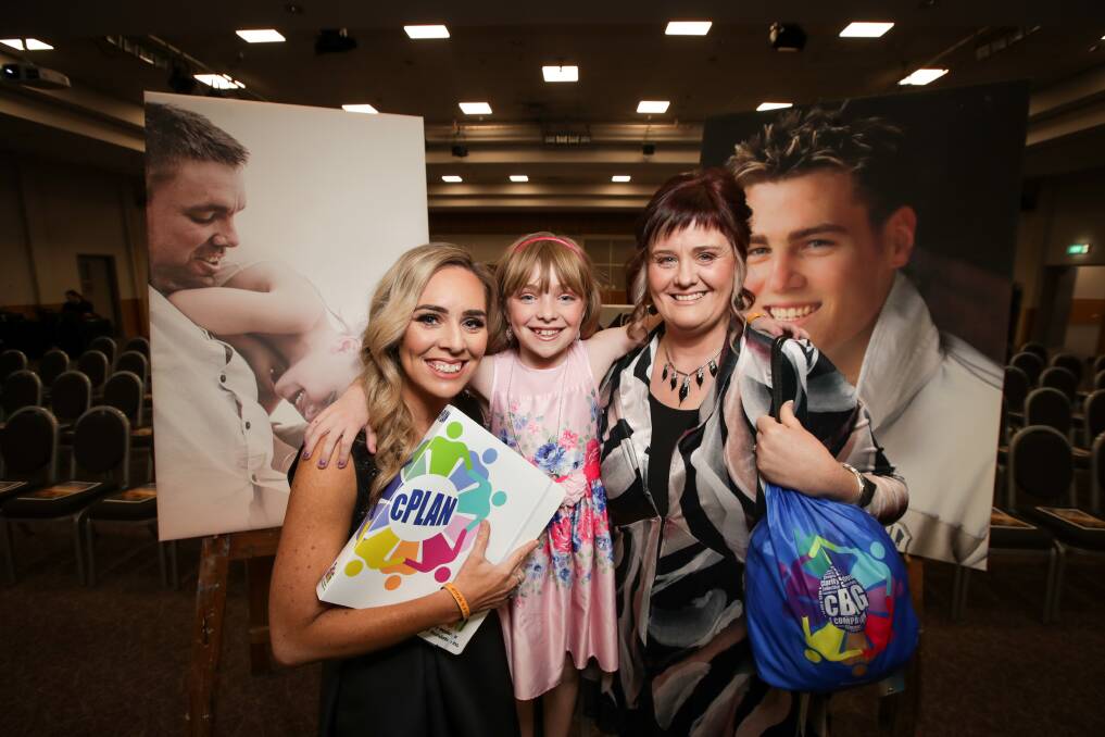 Cristy Jacka and her daughter Lucy, 10, and Jenny Jensen launched the cBAG with nearly 200 people in attendance on Friday night. Picture: JAMES WILTSHIRE