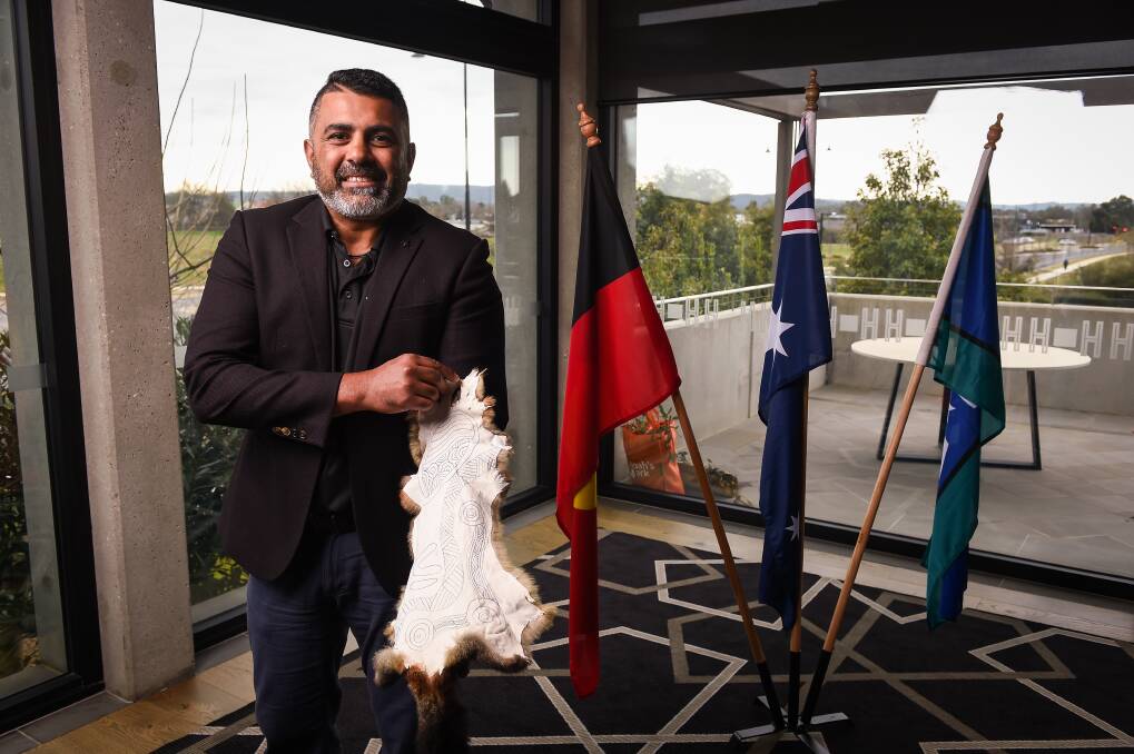 LISTENING: Commissioner for Aboriginal Children and Young People Justin Mohamed with the possum skin made during his visit to Wodonga for an inquiry. 'Our Youth, Our Way' follows on from the recent youth justice system review and is going to 13 regions. Picture: MARK JESSER