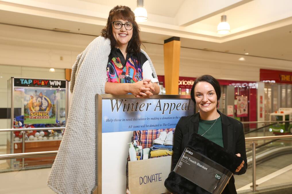 GIVE: Carevan director Jacqui Partington and West End Plaza marketing manager Nicole Singh at the drop-off point for Carevan's winter appeal. Picture: JAMES WILTSHIRE