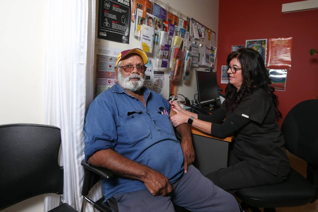 EASY DONE: Uncle Tunney Murray was among residents receiving their first COVID-19 vaccination yesterday from registered nurse Fiona Bradbury and the staff at Albury Wodonga Aboriginal Health Service yesterday. Picture: TARA TREWHELLA