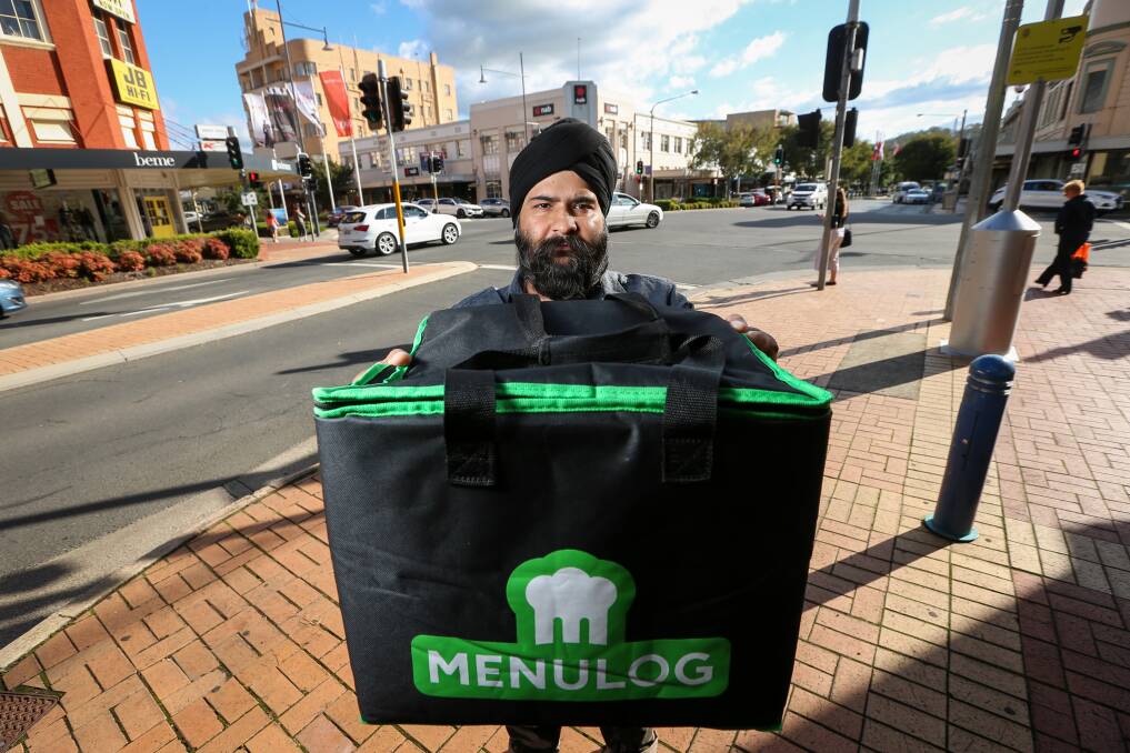 TO YOUR DOOR: Kamal Preet Singh delivers for Menulog, which has seen a 118 per cent growth in orders since February due to COVID-19. Picture: JAMES WILTSHIRE