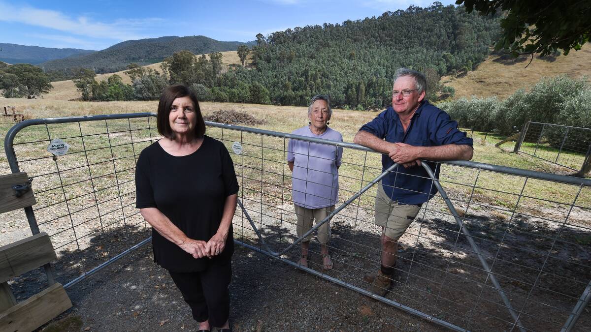 KINDNESS: Pat Easterbrook pictured on her property with Barwidgee resident Barbara Broz and Mudgegonga fire brigade captain Bernard Carroll, says it's the moments of empathy, some involving strangers, from Black Saturday that stay with her 10 years after the event. Picture: MARK JESSER