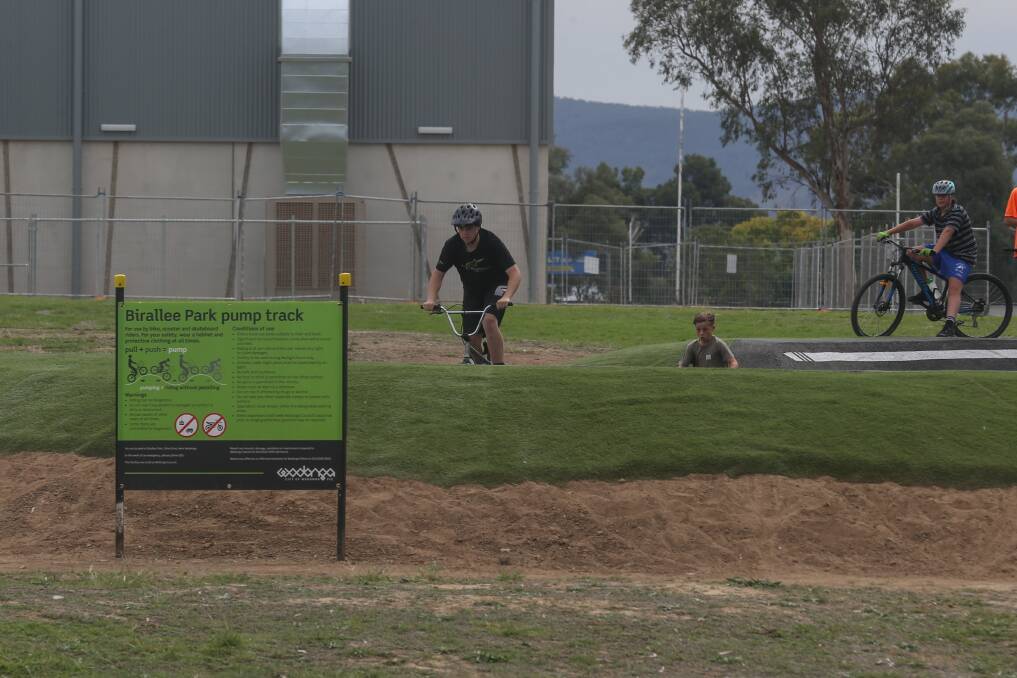 NO GO: Young people used the new Birallee Park pump track on Tuesday, before the government banned use of outdoor public play spaces. Picture: TARA TREWHELLA