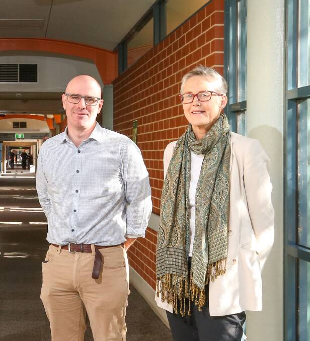 SUPPORT: Albury Wodonga Health clinicians David Clancy and Barbara Robertson, with 12 other members of the Border Medical Association, have backed the services plan.