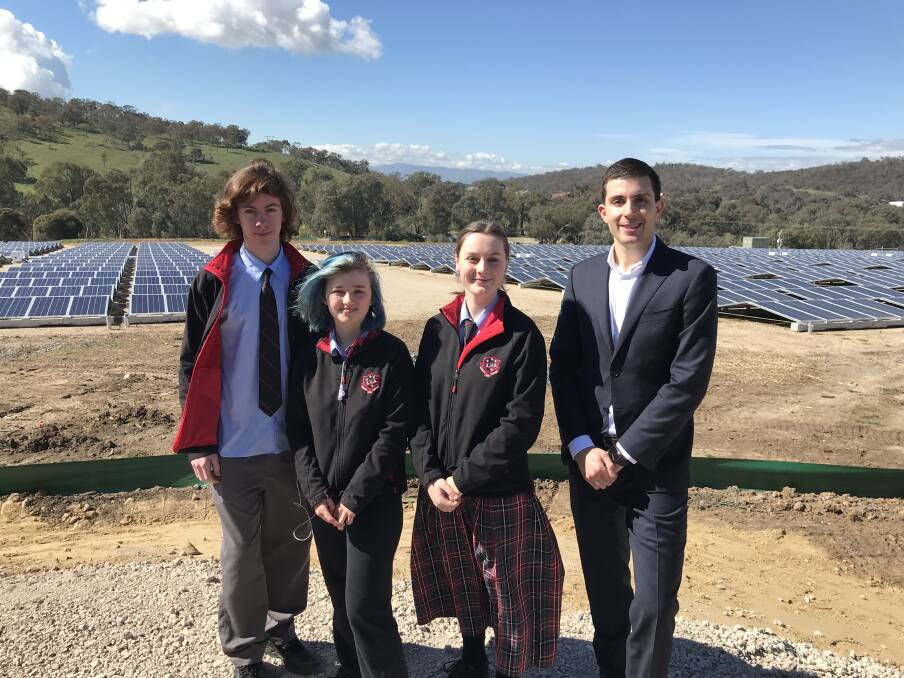 SOLAR SOLUTION: Albury High School year 11 students Ben Pedler, 16, Mimi Cosgrave, 16, and Tara Barter, 17, spoke to LMS Energy's Matthew Falzon at Albury council's renewable energy hub. 