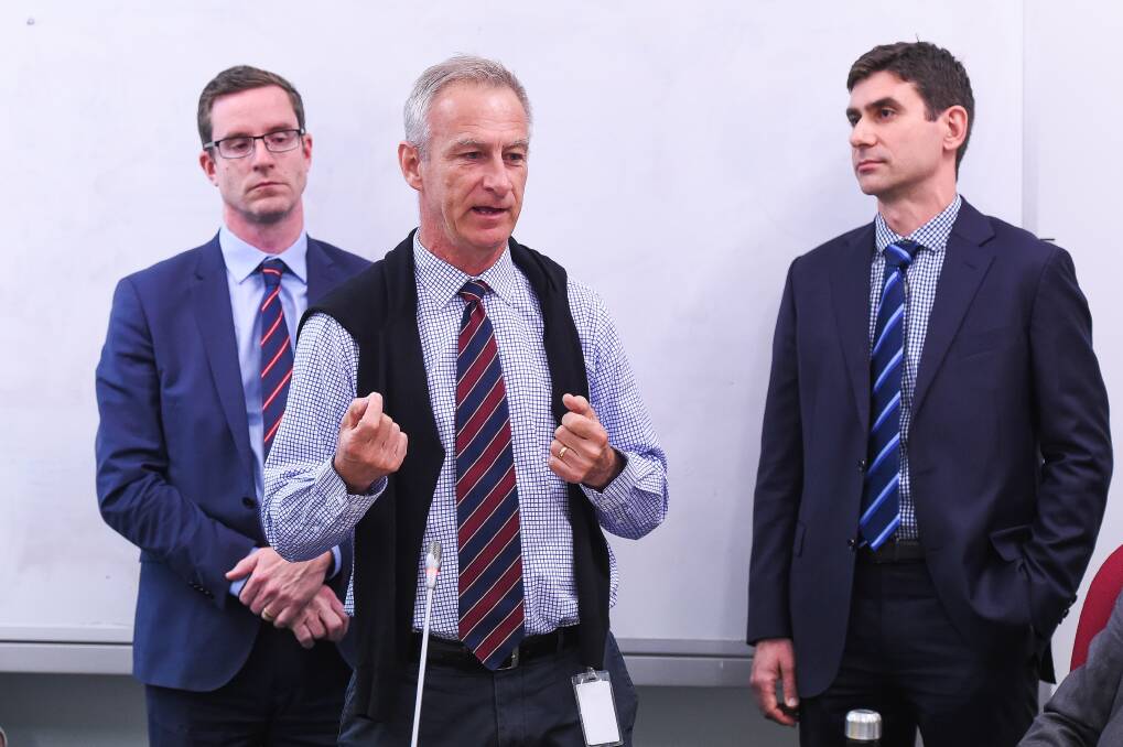 IT'S POSSIBLE: Loose fill Asbestos Taskforce operations director Stewart Scarlett, Public Works Advisory director Martin Dwyer and Property NSW director George Pajmakoski speak to councillors. Picture: MARK JESSER