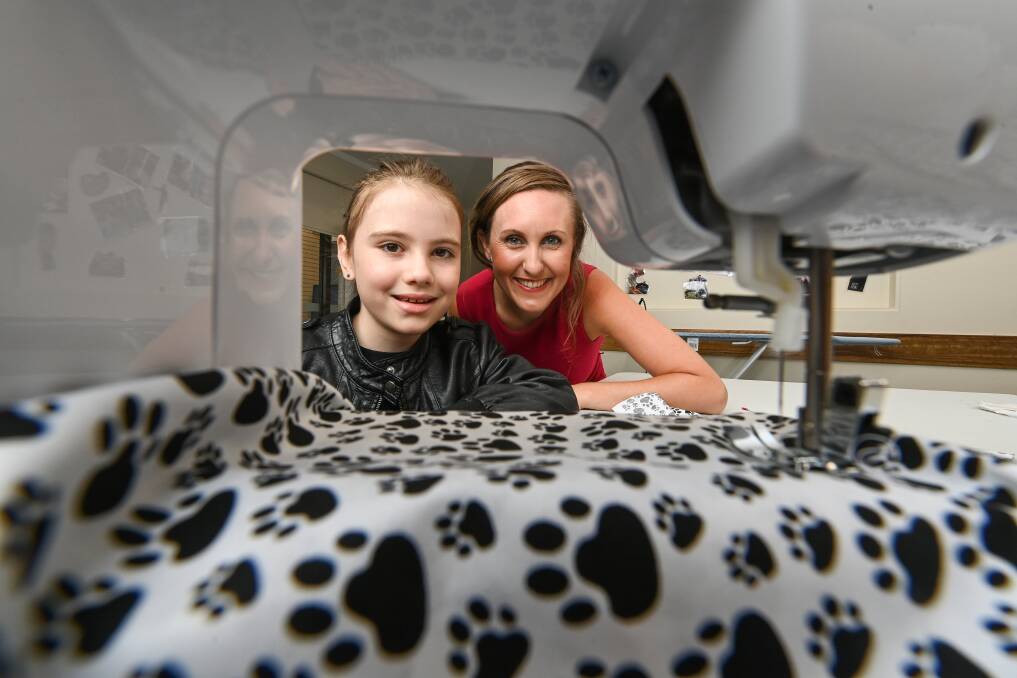 NEW SKILL: Artemis Ashcroft, 8, took part in Krystal Kaye's sewing workshops for kids at the Thurgoona Community Centre. Picture: MARK JESSER