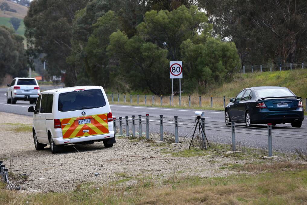 Cars' number plates being checked by Victoria Police near McKoy Street on Wednesday. Picture: JAMES WILTSHIRE