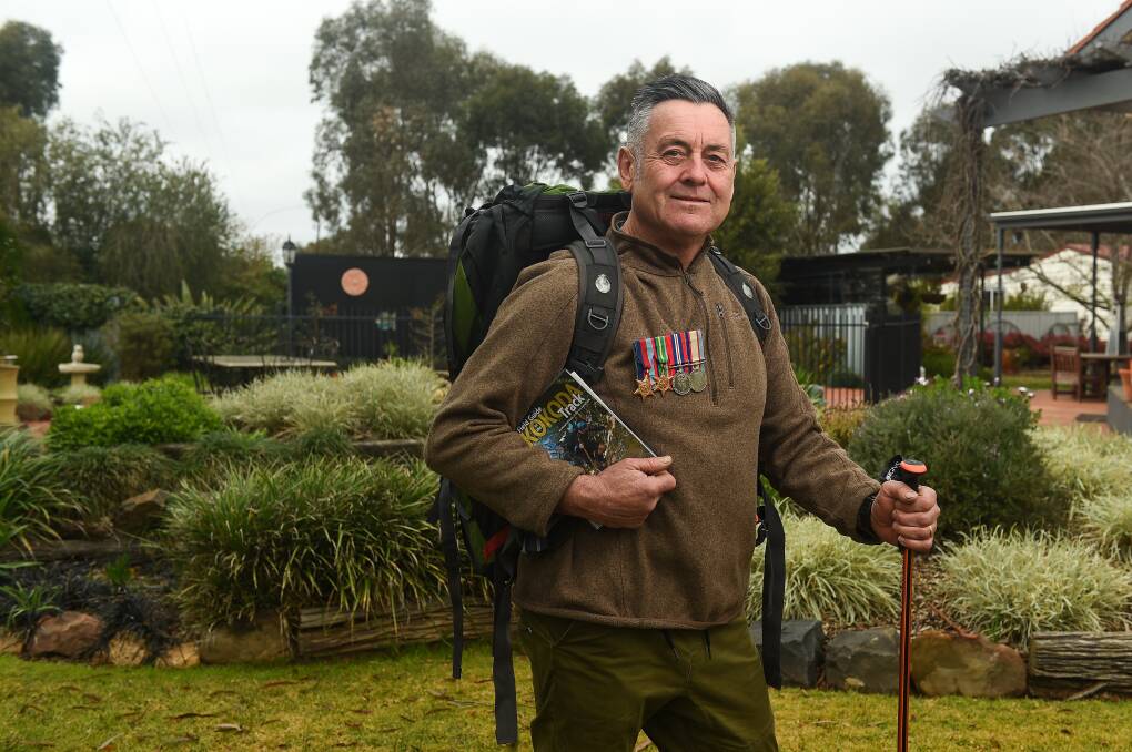 ON A MISSION: Corowa's Don Burrowes is fundraising for Australian Rotary Health for research into mental illness. He is undertaking the Kokoda Track after his personal experience with PTSD, wearing his father-in-law's medals. Picture: MARK JESSER
