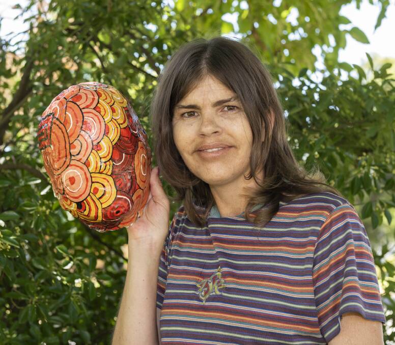 MASK LIFTED: An exhibition around Wiradjuri woman Leonie McIntosh's battle with a brain tumour, that she created using radiation masks, will be opened in Wednesday. An event to raise money for the cancer centre will follow.