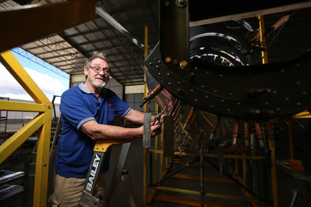 PIECE BY PIECE: Uiver Memorial Community Trust's Russ Jacob encourages Border residents to visit their hangar during an open day today. Picture: JAMES WILTSHIRE