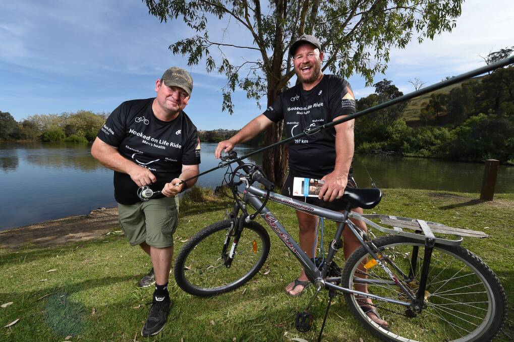 FISH AND RIDE: Milawa's Craig Gardam started the 'Hooked on Life' cycle and fishing trip from Khancoban to Mulwala to promote men's health and brought along Ross Madin. They finish at midday on Friday. Picture: MARK JESSER