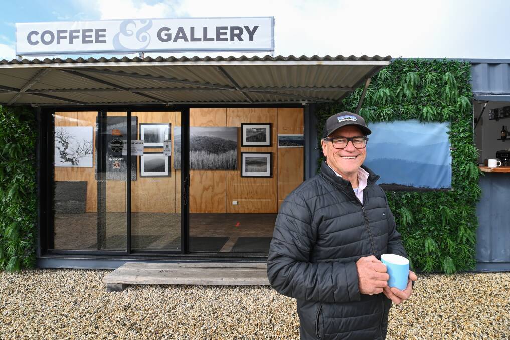 SIP AND PONDER: Mount Beauty photographer Charlie Brown has opened a pop-up gallery and coffee shop in the carpark of Kiewa Valley Snowsports. It will operate four days a week, from Friday to Monday. Picture: MARK JESSER